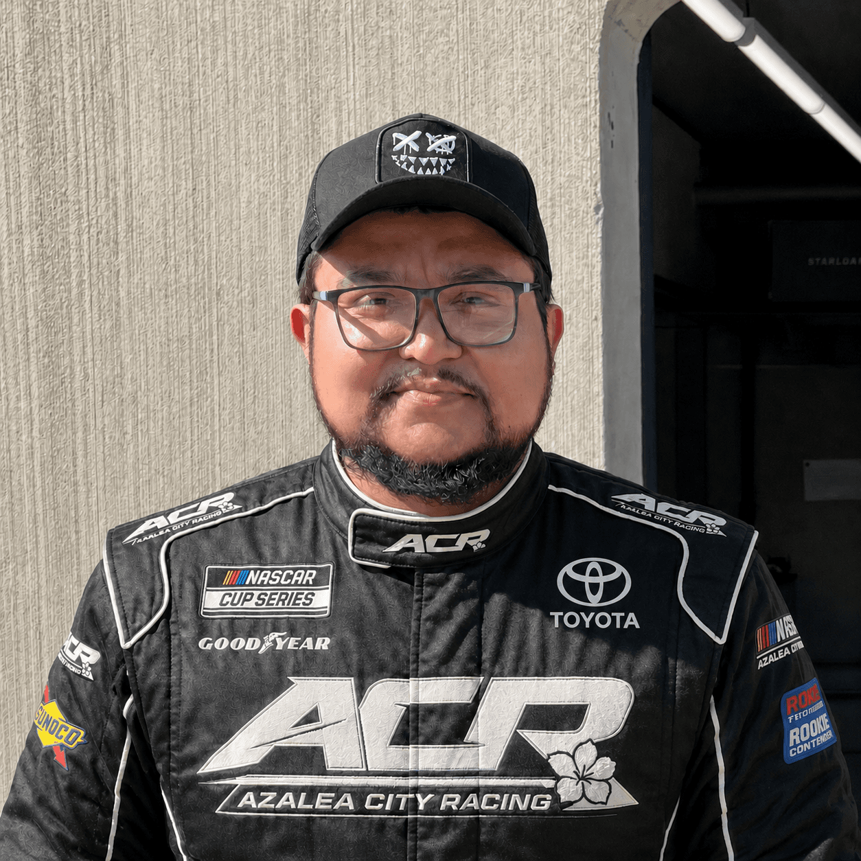 Misael Flores in a racing suit